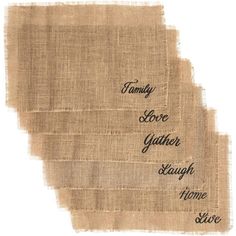 three pieces of burlied fabric with words on them that say family love, gather laugh and share