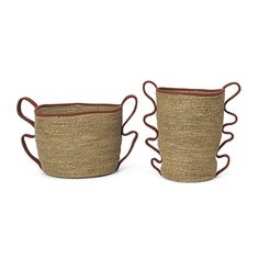 two woven baskets with handles on white background