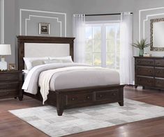 a bedroom scene with focus on the bed and dresser