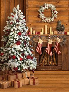 a decorated christmas tree in front of a fireplace