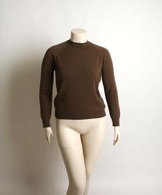 "FREE DOMESTIC SHIPPING! ♥ Lovely vintage 1970s chocolate brown blouse top! ♥ Back nylon zipper, long sleeves. Unique stitch details at the shoulders. ♥ In great condition! Designers Originals, action knit tag. Has a good stretch to it. Antron nylon. * measurements * Bust - 46\" Shoulders - 14\" Waist - 38\" Sleeve length - 24\" Length - 24\" Best fit a large! Does have a little extra stretch! ** I do ship worldwide! For more vintage cuteness, check out my store: → http://zwzzy.etsy.com ← ❀ Inst 1970s Blouse, Floral Print Tunic, Brown Blouse, Pink Tunic, Vintage 1950s Dresses, Brown Long Sleeve, Pink Cotton Candy, Pink Maxi Dress, Long Puff Sleeves