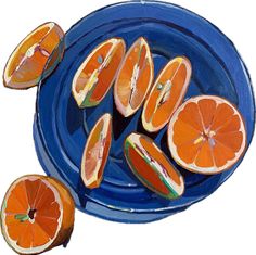 some oranges are cut in half on a blue plate