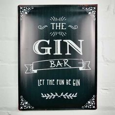 a sign that says the gin bar let the fun be gin