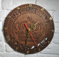 a clock on the wall that says something to do with it and is made out of wood