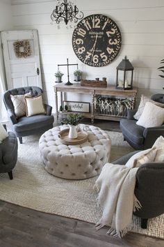 a living room filled with furniture and a large clock on the wall