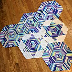 several hexagons are laid out on the floor to look like they have been cut