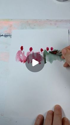 someone is painting the word love with watercolors