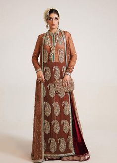 Pakistani Wedding Dress in Brown Sharara and Gown Style is a stunning attire embellished with Naqshi, Dabka, Sequins, Motifs, and Cut-dana. Fast shipping. Brown Sharara, Velvet Palazzo, Pakistani Gown, Wedding Sharara, Hussain Rehar, Shirt Gown, Maxi Frocks, Sleek Outfit, Net Gowns