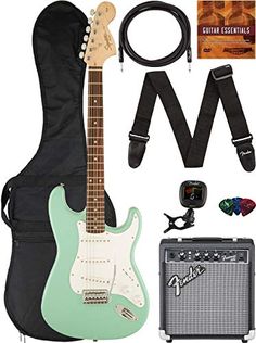 an electric guitar, amp and accessories are on display