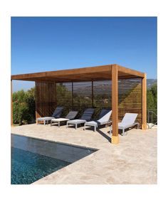 an outdoor pool with lounge chairs and a pergolated gazebo on the side