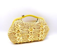 Raffia handbag Vibrant BUTTER yellowThe photos show up more bright yellow than butter yellow. Almost like new condition One scratch as shown in last photo. Measurements are approximate Height(including handle)7.5”Width 11”