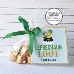 a bag filled with gold foiled chocolates next to a sign that says leprechaun loot from patrick