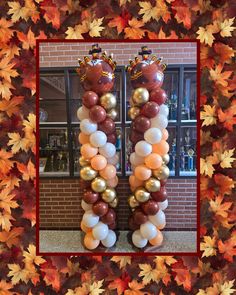 a frame made out of balloons and fall leaves