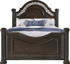 a bed with wooden headboard and foot board