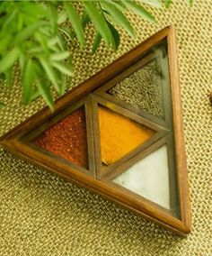 an assortment of spices sitting on top of a table