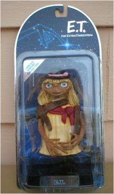 an action figure from the animated movie muppets, with blue eyes and brown hair