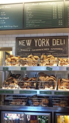 the new york deli is stocked with fresh breads and pastries for sale