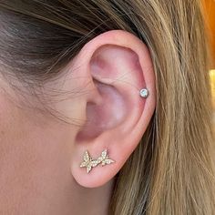 How fun are these asymmetric diamond butterfly studs! The butterfly represents hope and transformation. With this modern design, you can wear the single butterfly on one ear, and the double flutter on the other. Or, if you have multiple piercings, you can stack both studs on one ear to show all three fluttering by!Every sale supports survivors of campus sexual assault through our nonprofit Restore Dignity, providing rent, medical, and tuition assistance. Diamonds (0.16 ct)14k yellow goldAlways p Diamond Ear Studs, Small Butterfly Earrings Gold, Gold Plated Butterfly Earrings, Hypoallergenic Gold Butterfly Earrings, Gold Butterfly-shaped Pierced Earrings, Sparkle Hoop Earrings, Elegant Gold Butterfly-shaped Earrings, Gold Butterfly Ring, Boulder Opal Necklace