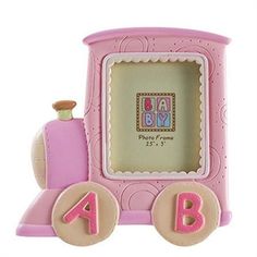 a pink toy train with the letter b on it