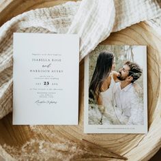 an image of a couple on their wedding day with the save the date card in front