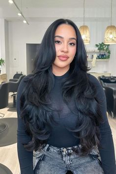 Long layered haircut with voluminous soft waves, showcasing a rich, dark color that adds depth and shine. The gentle middle part frames the face elegantly.  // Photo Credit: Instagram @jem.hair Black Layered Long Hair, Front Frame Haircut, Face Framing Middle Part, Layers With Thick Hair, Long Layered Haircuts For Long Hair, Butterfly Layers Straight Hair, Long Layers Volume Haircut, Black Haircut Women Long, Face Framing Hairstyle