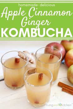 three glasses filled with apple cinnamon ginger kombucha next to apples and cinnamon sticks