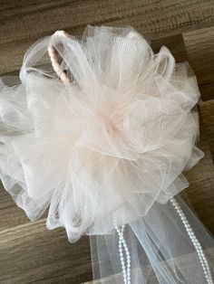 This super cute set of 2 his and hers Wedding Pom Bow, would look perfect for your special day. These bows are made using 6 inch wide tulle ribbon. These bows  would look picture perfect on flower girl baskets, gift tables, guest sign in books, chair decor, and arches.  Each bow measures approximately 8 inches across from largest loop to largest loop. It is about 24 inches long counting top of Pom to bottom of the longest tail. Tails are about 19 inches long.   The back of the Pom bow has a braided loop that has about a 5 inch opening. Picture shown. There are a total of 50 loops and 8 tails with 4 stands of cream  opal colored beads  that measure about 17 inches long, this makes for an elegant look! Need larger loops for the backing, just let me know when ordering.  This listing is for a Pew Bows Wedding, Wedding Pews, Tulle Ribbon, Deco Mesh Wreaths Diy, Pew Bows, Bow Wedding, Mesh Wreath Diy, Chair Decor, Ribbon Decorations