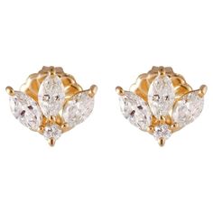 Lovely pair of 18k yellow gold and dainty 0.80 carat marquise and petit sparkling round diamond leaf studs. The marquis shape flashes bursts of light, shimmer and shine with every move, making them perfect as a second piercing stud for layering with your favorite pair of earrings. Piercing Stud, Second Piercing, Fan Earrings, Shimmer N Shine, Marquise Diamond, Round Diamonds, Heart Ring, Jewelry Earrings, Gems