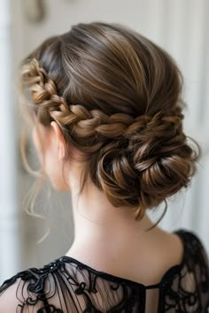 A polished bun situated at the crown with a braid wrapped around, suited for a classic and sophisticated prom style that exudes elegance. Junior Bridesmaid Hair, Hairstyle Bridesmaid, Bridal Hairstyles With Braids, Κούρεμα Bob, Braided Updos, Wedding Day Hair, Wedding Guest Hairstyles, Fishtail Braid, Bridesmaid Hair Updo