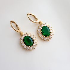 Emerald Green & Crystal Teardrop Teardrop Jewel Huggie Hoop Earrings, 14k Gold Plated Earrings, Vintage Style Earrings, Victorian Earrings  Product specifications: * Material: 14K Gold Plated Brass * Size Each charm measures 1.5 cm x 1.7cm Hoops: 1.1cm outer diameter. Packaging and Gifts: * All pieces of jewellery are set on a card in a mesh jewellery pouch  Shipping: * All Australian orders will be shipped out within 1 - 3 days by standard untracked letter post. If you require tracking, please upgrade to that option at the time of checkout. I cannot be held responsible for missing orders if you do not upgrade. Delivery within 5 - 6 days. INTERNATIONAL BUYERS please note shipping can sometimes take up to 3 weeks. Care instructions: * Cleaning your jewellery: A wipe with a microfiber cloth Emerald Green Crystal, Victorian Earrings, Jewellery Pouch, Vintage Style Earrings, Green Crystal, Huggie Hoop Earrings, Earrings Vintage, Style Earrings, Gold Plated Earrings