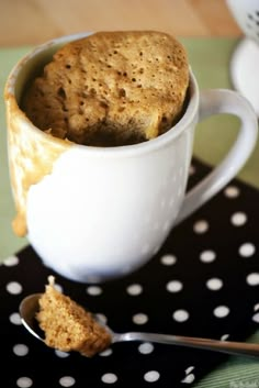 a cup filled with food sitting on top of a table