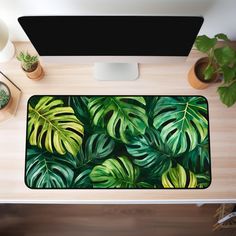 This tropical nature-inspired monstera leaves desk mat is a great choice for enhancing the aesthetic of your workspace. Not only is it practical, ensuring comfort while you work, but it also brings a unique charm and personalizes your work or gaming space. It also makes a wonderful birthday or Christmas gift for coworkers, gamers and crafters. 🌻 PRODUCT DETAILS: Our desk mat features 3mm thick neoprene material, an anti-slip backing which ensures your desk mat won't slide while in use and hemme Tropical Desk, Desk Decor Aesthetic, Plant Desk, Cute Office Decor, Gaming Space, Tropical Nature, Aesthetic Desk, Christmas Gifts For Coworkers, Cute Office