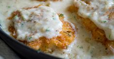 chicken parmesan with gravy in a skillet