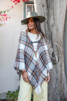 This Classic Flannel Toggle Poncho is the ultimate in cozy, warm chic! The soft flannel and fun toggle closure make it perfect for those colder days. Throw it on over your favorite outfit to keep warm and look stylish too! Imported Sorority Rush Dresses, Bachelorette Dress, Casual Bodysuit, Rush Dresses, Jumpsuit Shorts Rompers, Plaid Fashion, Dressy Tops, Womens Casual Outfits, Soft Flannel