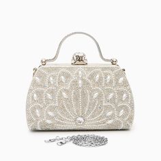 Introducing the Augustine Pearls Handbag - an enchanting masterpiece crafted to elevate your evening attire to unprecedented levels of sophistication. This clutch exudes magnificence in every detail, adorned with shimmering rhinestones and delicate pearl accents. Remarkably lightweight, it guarantees seamless carrying all through the night without compromising on style. Now available in blue, black, silver, and red. Tambour Beading, Bangle Ring, Love Ring, Evening Attire, Bag Set, Necklace Earring Set, Clutch Handbag, Name Necklace, Gemstone Colors