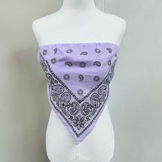 a white mannequin wearing a purple bandana