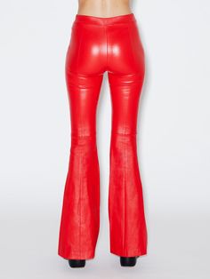 Cut to flatter and elongate the body, this ultra-soft leather pant has a mid-rise, flared-leg silhouette. Pintuck seaming down the front lengthens further, while the elasticized waist enhances the ease of wear — imparting a relaxed sensibility to the otherwise luxe style. The center point of Rosetta Getty’s popular leather offering, this Stretch Plongé fabric pairs buttery-soft lambskin with a stretch cotton backing for a leisurely feel. Tanned in France, it has a sexy, slightly shiny finish whi Red Leather Pants, Knee Boots Outfit, Center Point, Luxe Style, Rosetta Getty, Leather Pant, Pin Tucks, Boots Outfit, Stretch Cotton