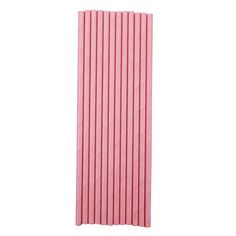 pink paper straws are lined up against a white background