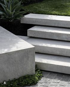 concrete steps leading up to the grass