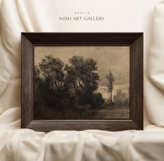 an image of a painting in a frame on a white bed with the words nish art gallery above it