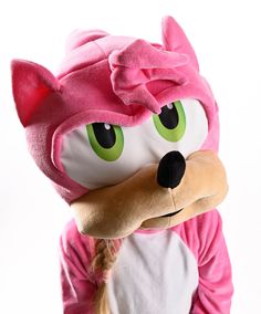 a person wearing a pink animal costume with green eyes and a long braid in front of a white background