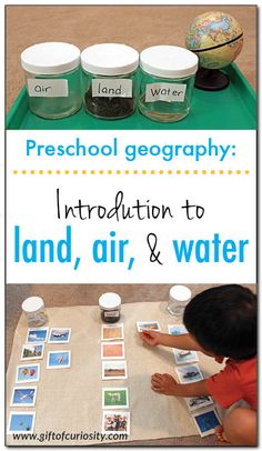 an image of a child playing with land, air and water in front of some jars