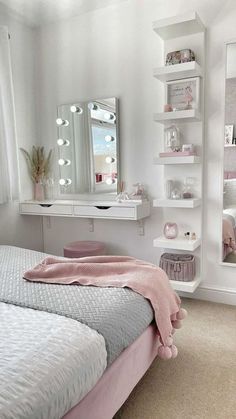 a bedroom with a bed, mirror and shelves on the wall next to each other