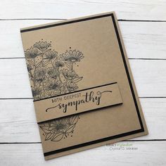 a handmade sympathy card with flowers on the front, and an envelope that says sympathy