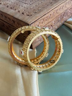 Set of 2 Bangles Ruby Pearl Broad stone matte gold finish. Premium quality These are openable. American Diamond Necklaces, Oxidized Necklace, Polki Necklace, Western Earrings, Ethnic Necklaces, Ethnic Earrings, Kundan Necklaces, American Diamond, Acrylic Earrings