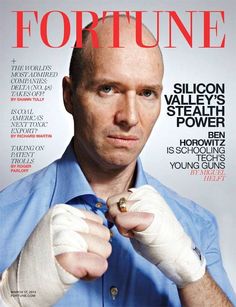 a man in blue shirt and white gloves on the cover of fortune magazine with his fist raised