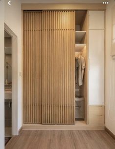 a closet with wooden slats and sliding doors