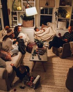 a group of people sitting on couches in a living room