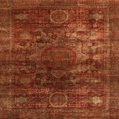 an orange and red rug with many different designs on the carpet, including a medallion design