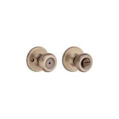 an image of two knobs on a white background, one is in satin brass